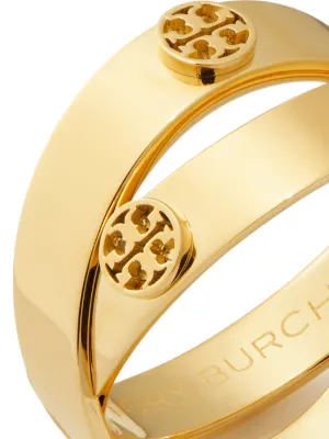 The Icon Double Ring features two intersecting bands adorned with Double T studs.
