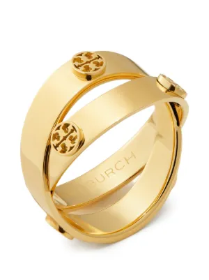 The Icon Double Ring features two intersecting bands adorned with Double T studs.